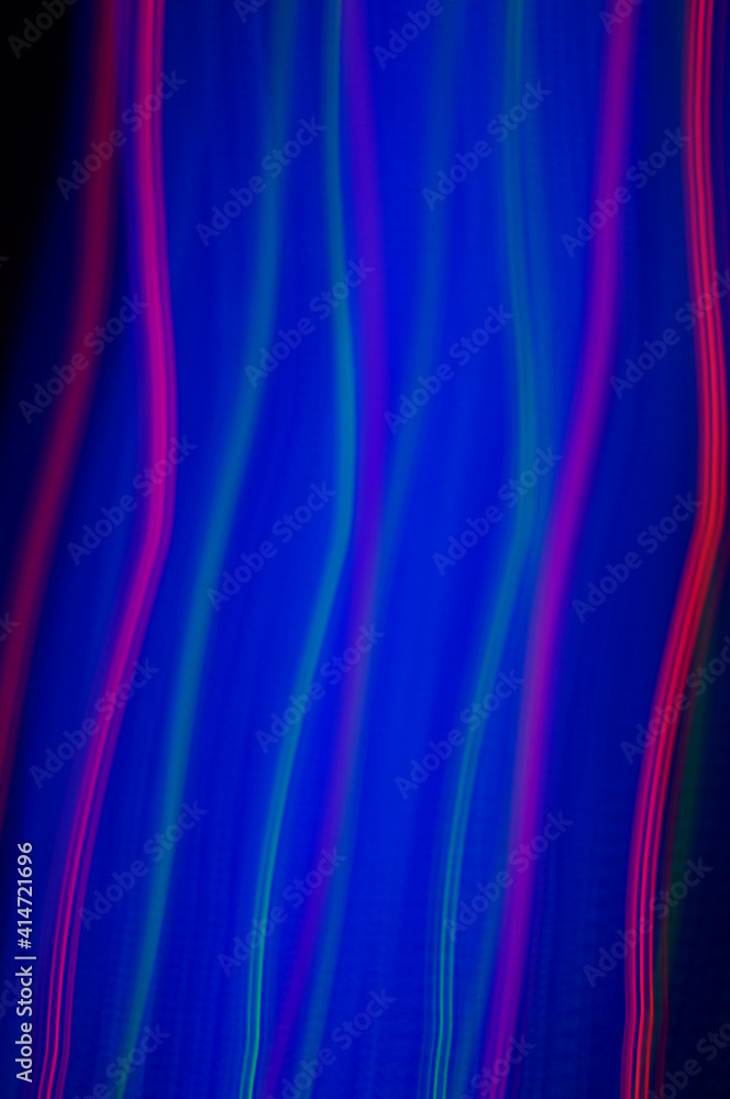 Fototapeta premium Blue smeared neon with red thin lines, on black background. Abstract line in highmagnification. Red threads on blue and black background. Fancy background for lettering or graphics.