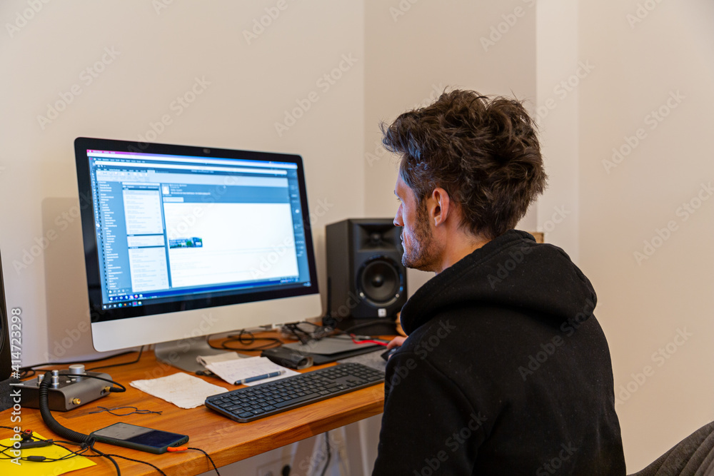 Man with big hair working at home office Man with big hair working at home office