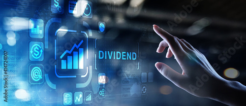 Dividends button on virtual screen. Return on Investment ROI financial business wealth concept.