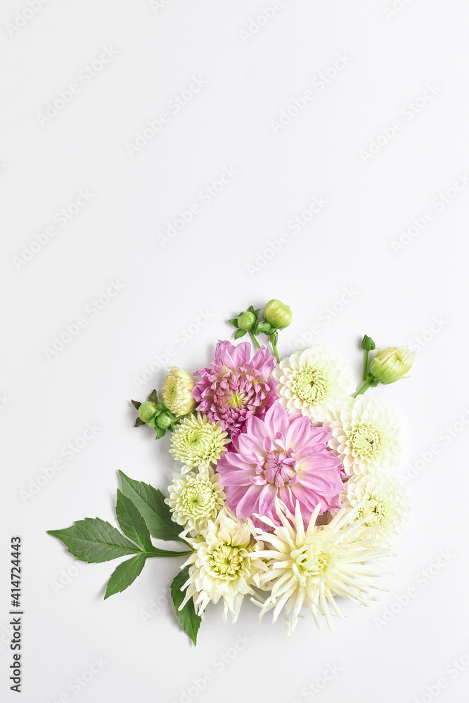 flower arrangement. large Dahlia flowers on a light background. wedding layout, copy space, vertical frame