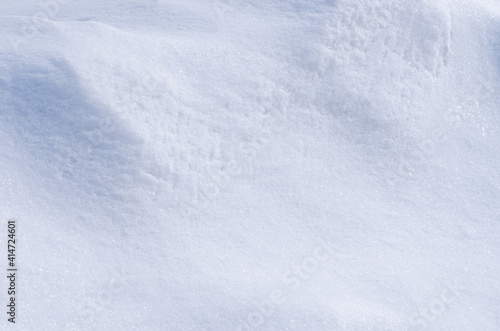 Background of fresh white snow. Winter snowflakes texture.