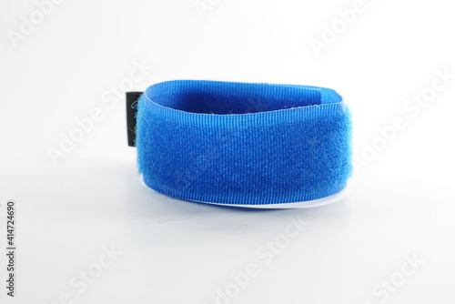Foto Closeup of a blue velcro wristband isolated on a white background