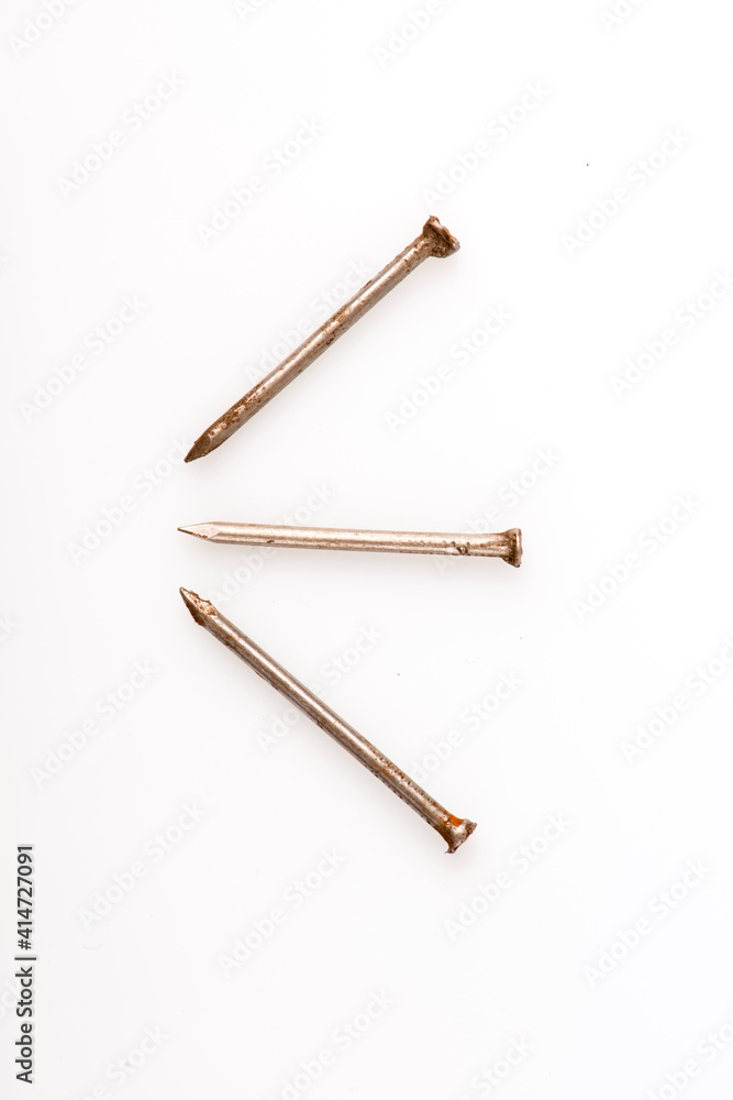 Steel nails 4-inch isolated on white background. Steel nails 4-inch isolated on white background.