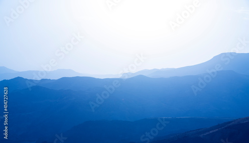 Blue mountain ranges silhouettes of mountains. 