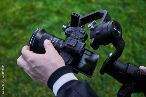 Video camera operator working with professional equipment close up © amixstudio