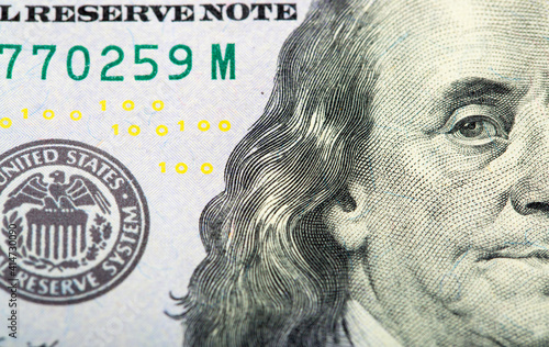 Hundred dollar bill close up. Beautiful original cash flow. One hundred bucks as a background on a long banner in high resolution. photo