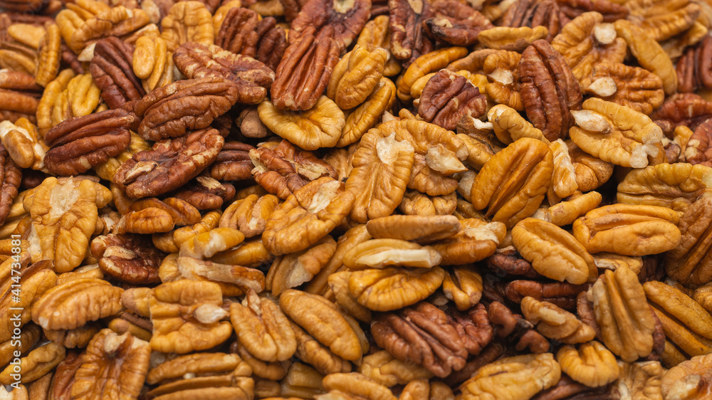 Tasty pecan-nut background. Top view. Tasty pecan-nut background. Top view.