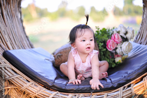 Small child girl sitting with happiness of 8 months old, Portrait cute baby girl asia of 8 months old