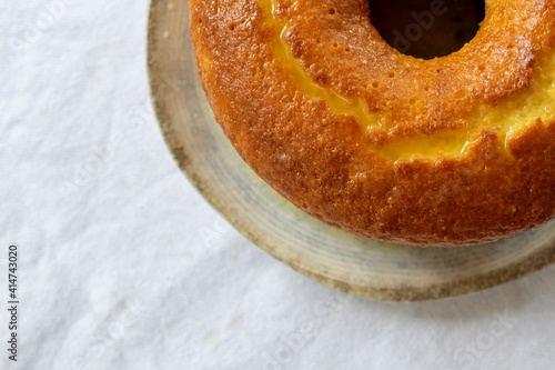 orange cake on rustic plate with space for text. top view photo