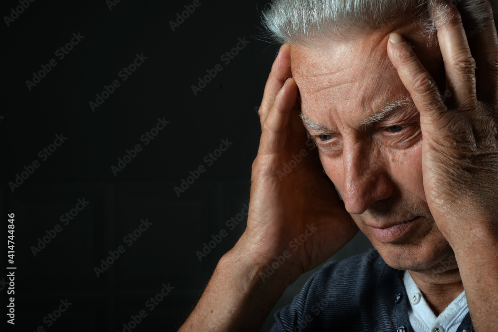 Portrait of sick senior man with headache Portrait of sick senior man with headache