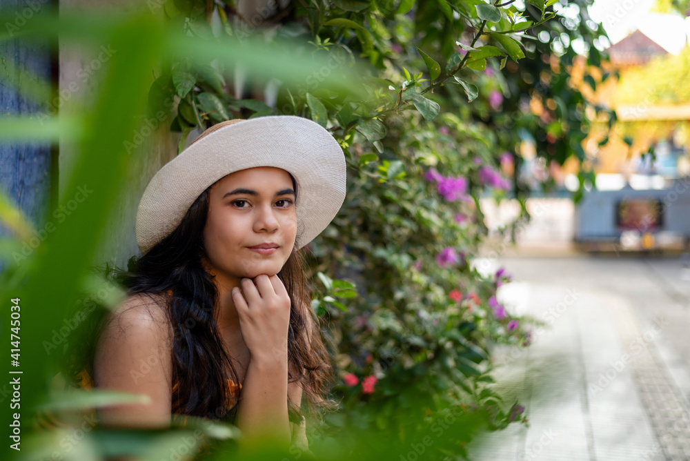 Fototapeta premium Beautiful Colombian woman with colorful outfit in the old city of Cartagena, Colombia