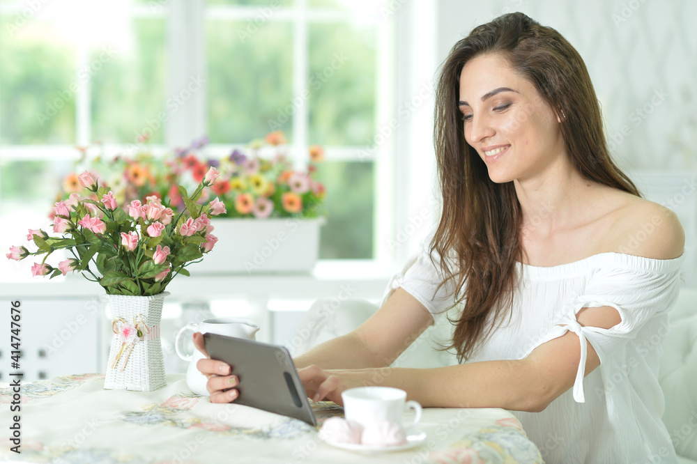 Portrait of woman using tablet computer taking selfie Portrait of woman using tablet computer taking selfie