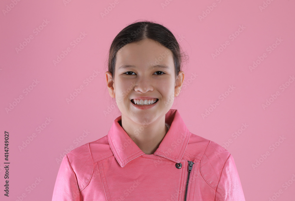 portrait of a teenage girl in a pink leather jacket on a pink background portrait of a teenage girl in a pink leather jacket on a pink background