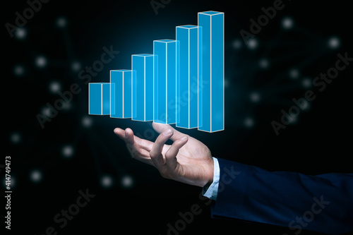 Businessman man holding a graph