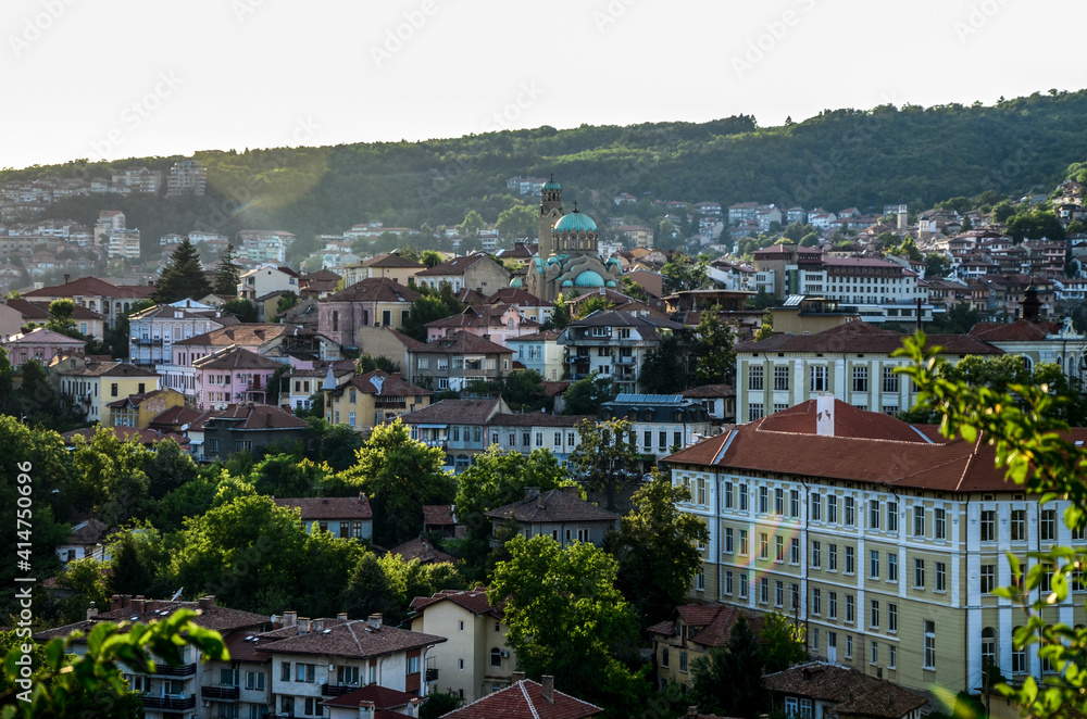 Beautiful view over the old town with a traditional architecture of Veliko Tarnovo on a summer day at sunset. Bulgaria