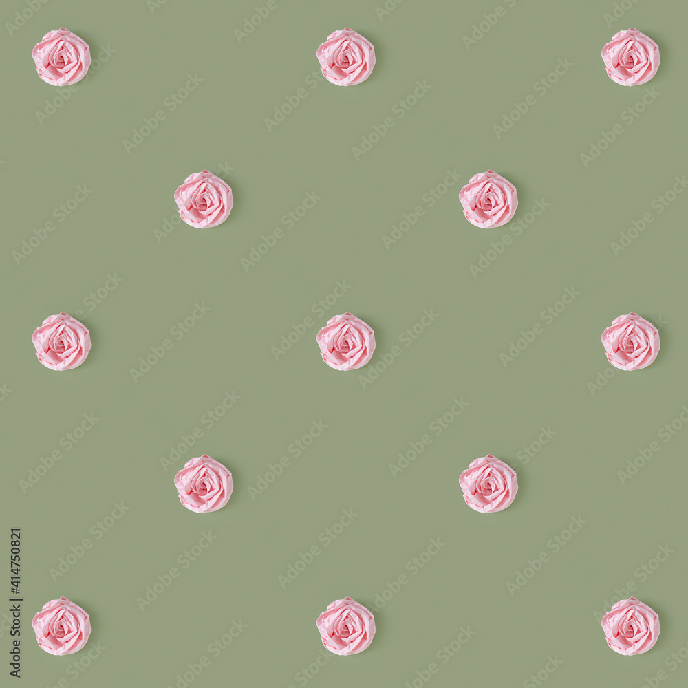 Flowers from a crumpled napkin form a repeating pattern on a dark pistachio background.Top view. Minimal design concept Flowers from a crumpled napkin form a repeating pattern on a dark pistachio background.Top view. Minimal design concept
