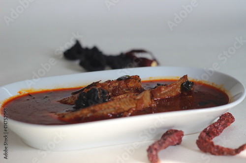 Sardines curry is a traditional central Kerala fish curry also known as mathi curry. photo