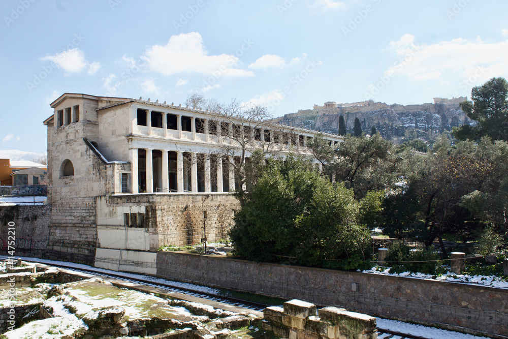 Athens, Greece - February 17 2021: Ancient Agora and Acropolis view in winter with snow
