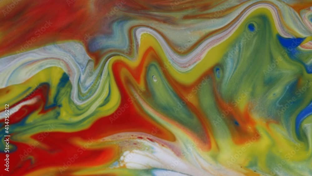 Liquid abstractions. Deep ink spaces. Moving abstract colorful background. Mixing paint colors. Blue color, white color, red color, green color, gold dust.