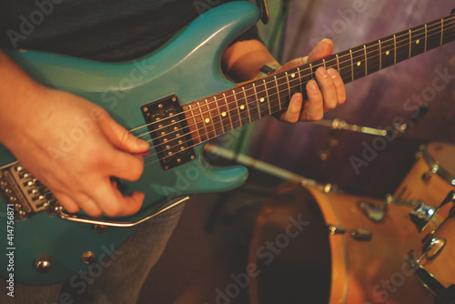 guitarist plays the electric guitar close-up. band rehearsal
