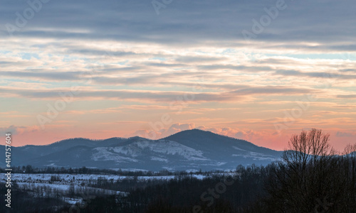 View of the mountains with spectacular clouds above them in the sunset © Byby Photography