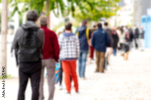 Schilderij op canvas unfocused people queue in line up draggle