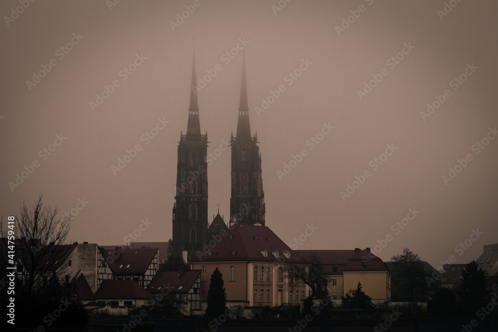foggy basilica on an island in the city of wroclaw poland at sunrise