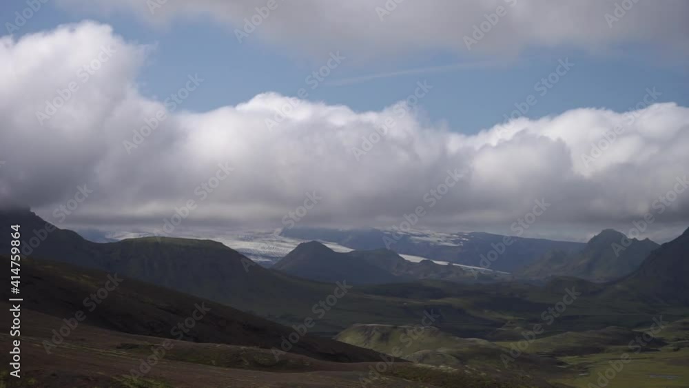 View mountain valley with green hills, river stream and lake. Laugavegur hiking trail, Iceland View mountain valley with green hills, river stream and lake. Laugavegur hiking trail, Iceland