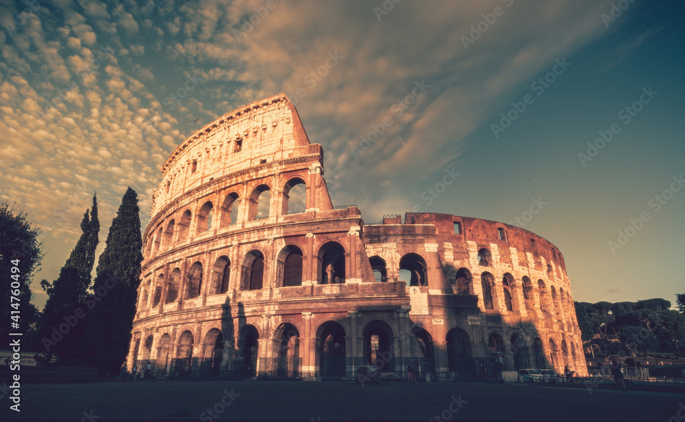 colosseum at sunset, soft warm clouds