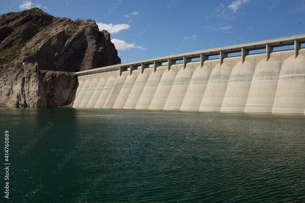 Peaceful lake landscape with beautiful saturated blue tones and the dam Peaceful lake landscape with beautiful saturated blue tones and the dam