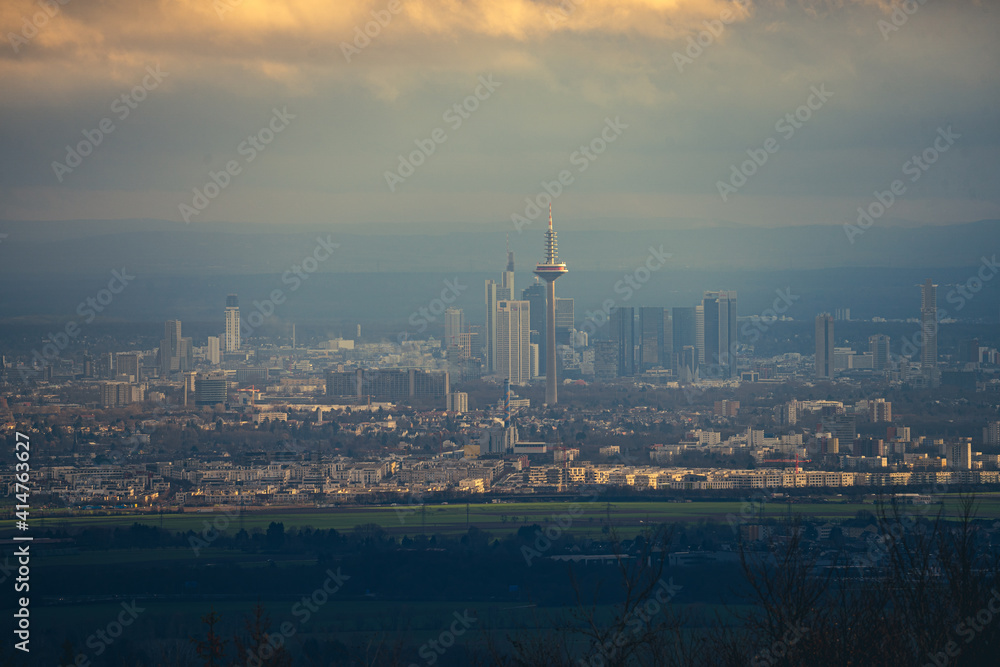 Fototapeta premium The skyline of the financial district of Frankfurt at sunset blue hour with fantastic sky and clouds