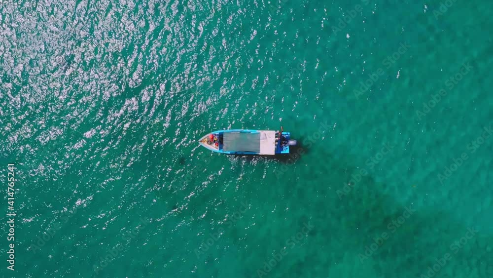 Drone Shot of Boat of single boat in the azure caribbean sea in the lagoon. High quality 4k footage Drone Shot of Boat of single boat in the azure caribbean sea in the lagoon. High quality 4k footage