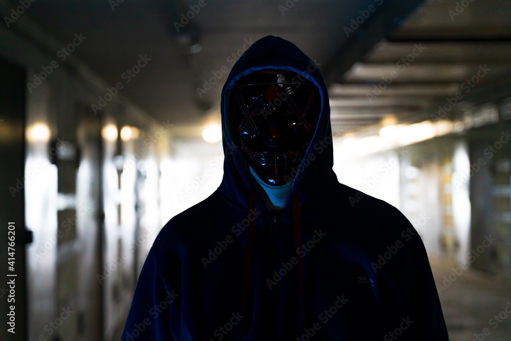 Masked criminal on the dark. Selective focus Masked criminal on the dark. Selective focus