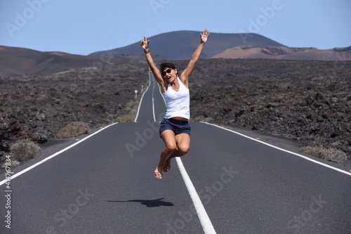 woman jumping on the road