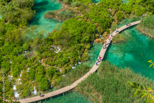 Aerial view of a wooden boardwalk leading through plitvice lakes national park in Croatia photo