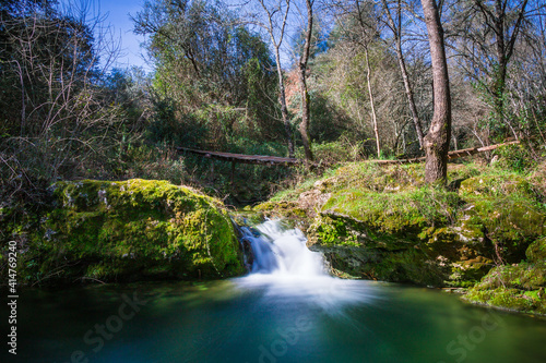 Fototapeta Naklejka Na Ścianę i Meble -  River waterfall with silky water in the little village of Beselga, Portugal
