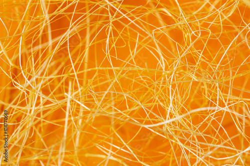 Golden dry straw texture, rolled decorative spiral, tangled curls of shavings. Option for Easter background photo