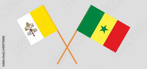 Crossed flags of Vatican and Senegal