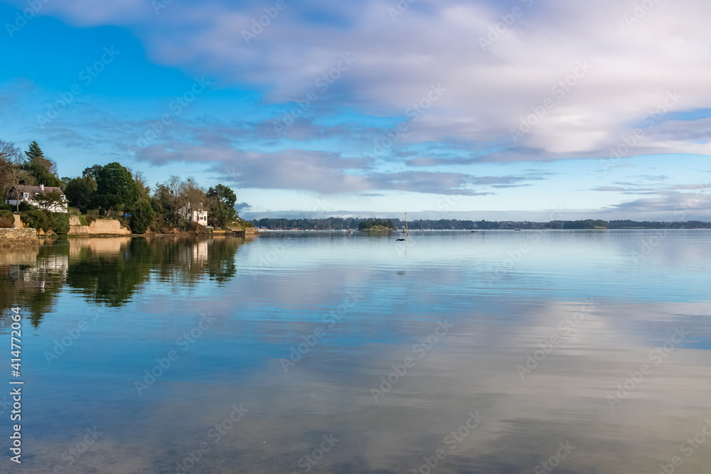 Brittany, Ile aux Moines island in the Morbihan gulf, the church and the Port-Miquel beach, beautiful light
