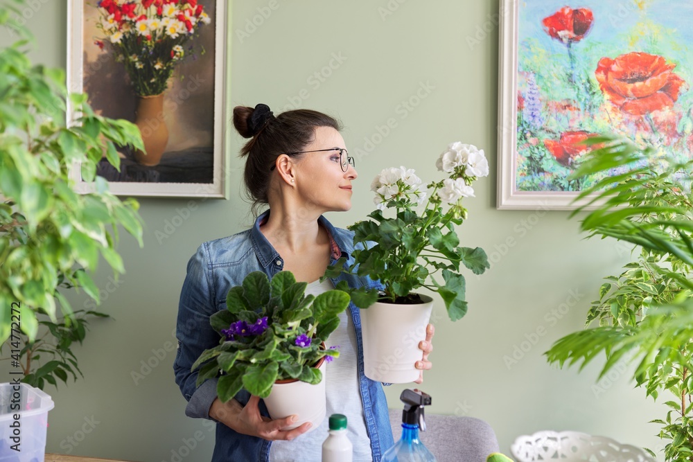 Portrait of woman with houseplants, hobbies and leisure, nature in the house Portrait of woman with houseplants, hobbies and leisure, nature in the house
