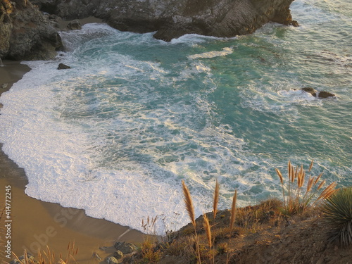 the beautiful view of the bay of the McWay Falls in the Julia Pfeiffer Burns State Park on the Big Sur coast of California in the month of October, USA