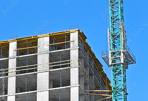 Crane and highrise construction site