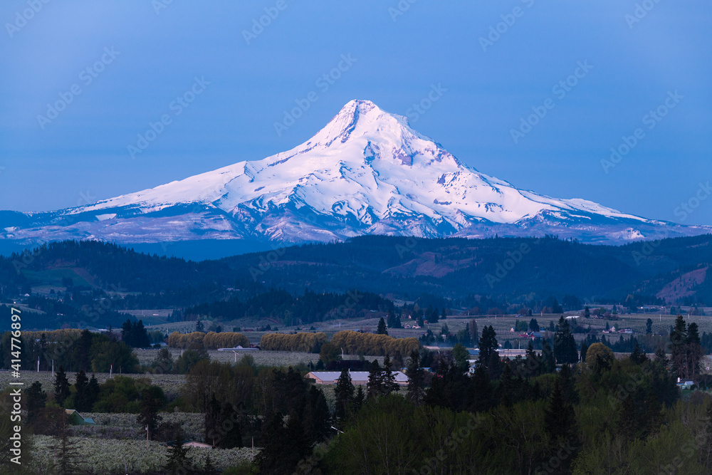 Volcanic Mount Hood standing tall in the dawn light of Northern Oregon