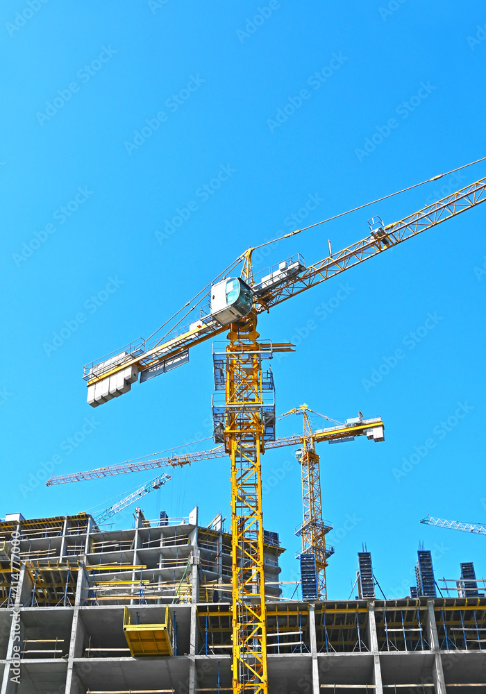 Fototapeta premium Crane and highrise construction site