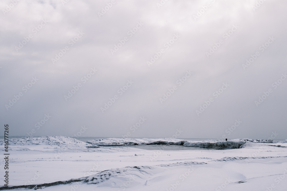 landscape with snow covered trees
Lake Michigan frozen in a cold Chicago winter