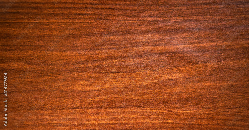 The texture is mahogany with stripes and splotches of black color The texture is mahogany with stripes and splotches of black color
