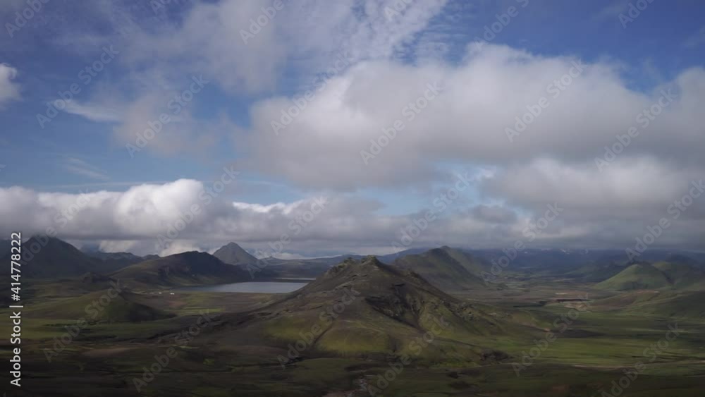 View mountain valley with green hills, river stream and lake. Laugavegur hiking trail, Iceland View mountain valley with green hills, river stream and lake. Laugavegur hiking trail, Iceland