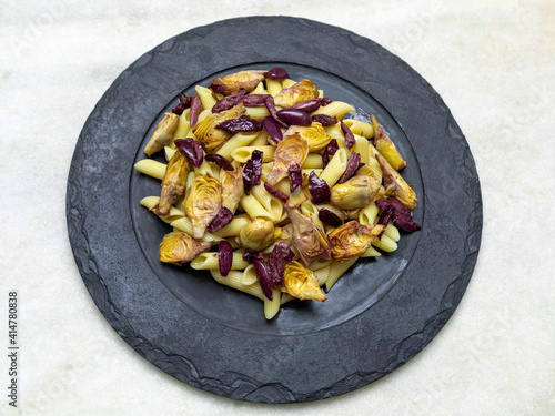Pasta with black olives and artichoke hearts,