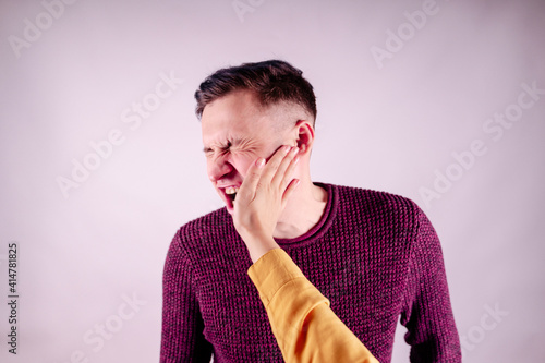 Fotografering Crop person slapping scared man in face