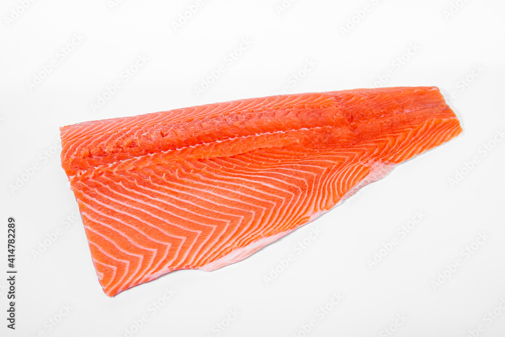Salmon fillet lies on a light background. View from above. Salmon fillet lies on a light background. View from above.